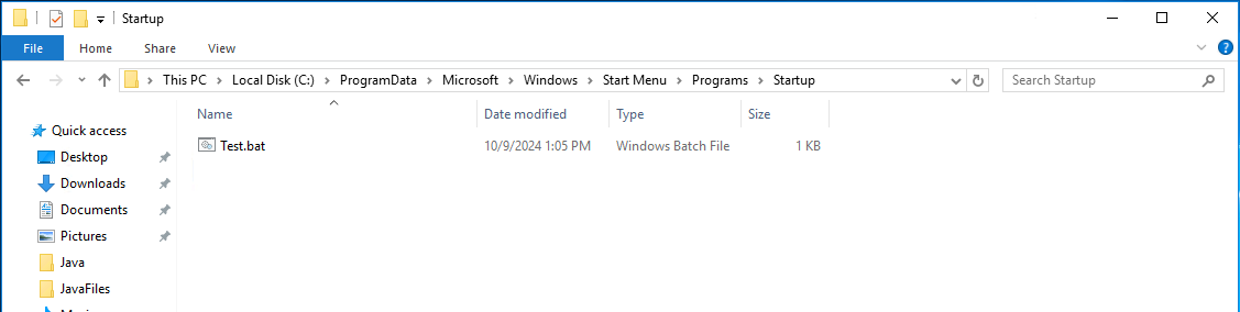 Screenshot from a Windows computer showing the 'Startup' folder with a .bat script inside.